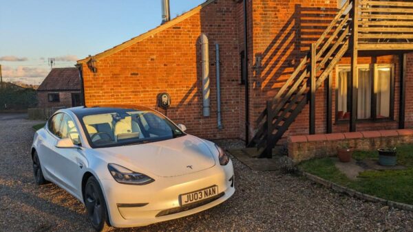 Tesla using electric vehicle charging unit