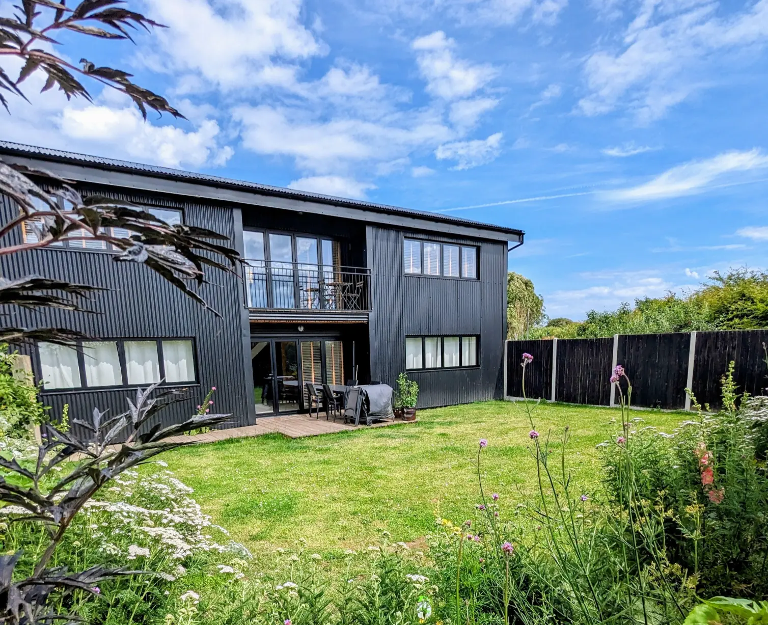 The Grain Barn Exterior. Contemporary Norfolk Holiday Cottage with Dog-Friendly Garden