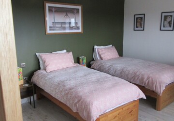 2 singles beds in a room