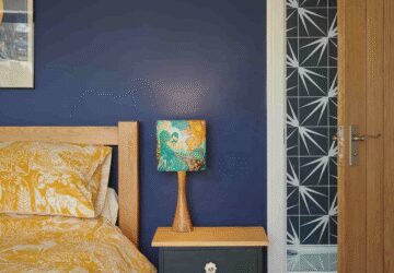 Blue bedroom leading to en suite