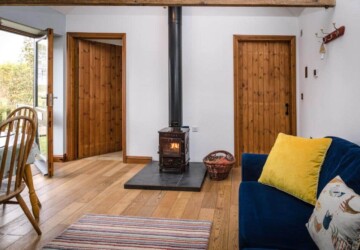 Wood burner stove in converted one bedroom barn