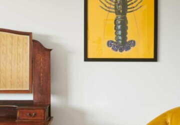 Yellow lobster poster against wall