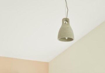 Grey lamp shade against pink wall
