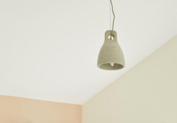 Grey lamp shade against pink wall